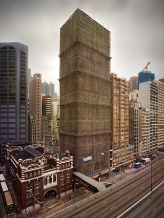 Illustration for article titled The Surreal Sight of Skyscrapers Encased in Colored Fabric